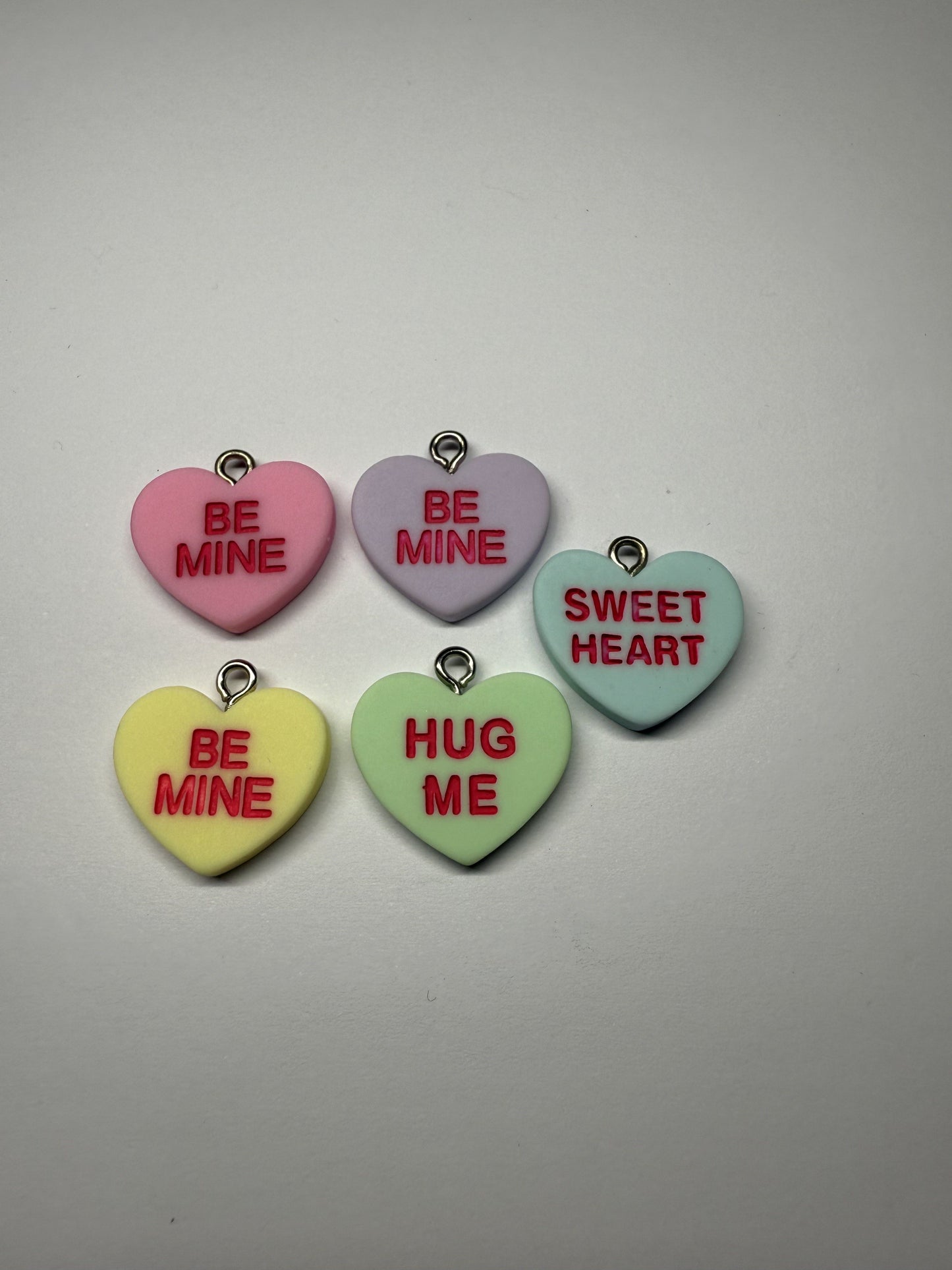 gekleurd hart met tekst Nr136a geel, b blauw, c groen, d paars