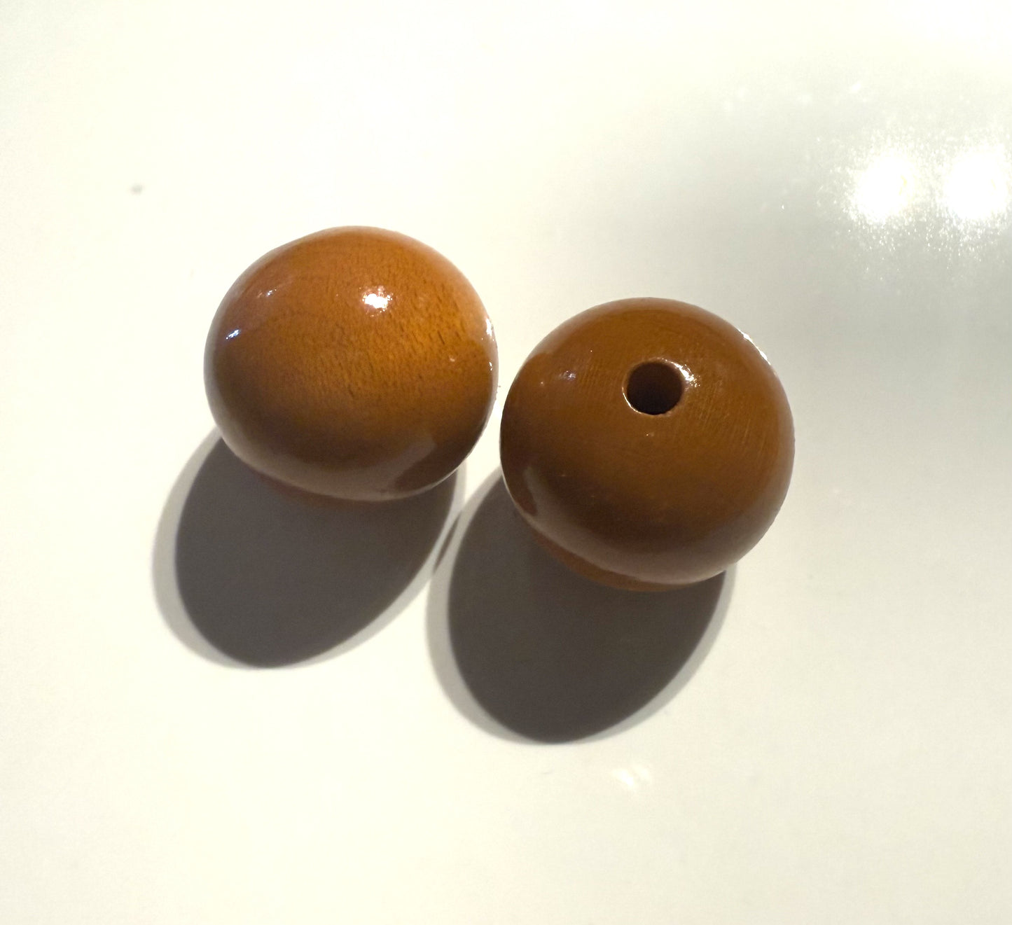 Oranje/bruin houten kraal 18mm