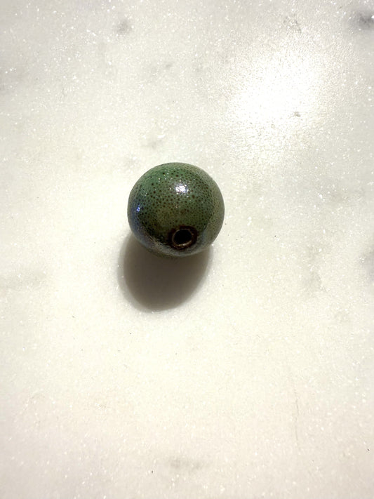 Groene keramiek kraal